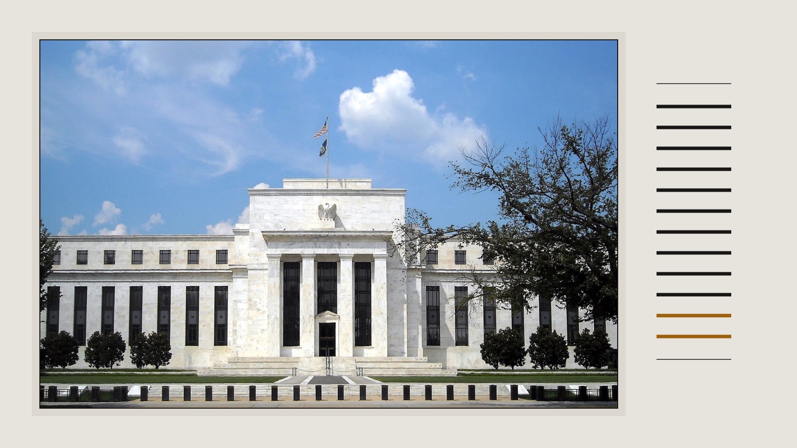 The white marble Eccles Building of the Federal Reserve in Washington under a blue sky, framed on warm grey beside twelve short lines, two in ochre.