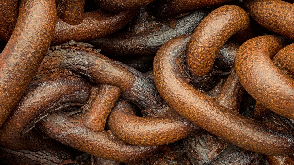 Close-up of heavy, rusty interlocking chain links